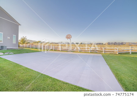 Outdoor all weather basketball court on a sunny day 74775174