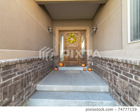 Pumpkins and wreath decoration for autumn in the shade Pumpkins and wreath decoration for autumn in the shade 74777159