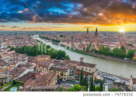 Verona Italy, high angle view sunset city skyline at Adige river 74778358