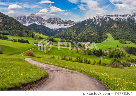 Dolomites Alps mountain landscape at Santa Maddalena village with walk path in spring season, St. Magdalena Italy 74778364