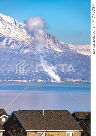 Plume of smoke rising from a fire on Utah Lake 74779787