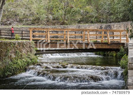 Wooden bridge over a waterfall in the Krka National Park in Croatia Wooden bridge over a waterfall in the Krka National Park in Croatia 74780979