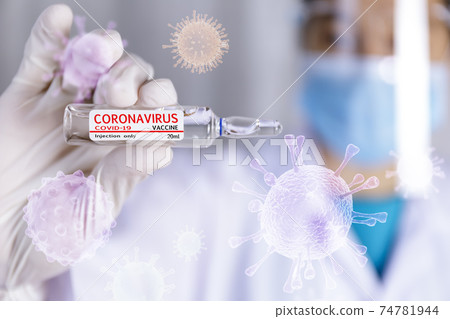 Covid-19 coronavirus vaccine. Close up hands of scientist show Covid-19 vaccine in glass vial. Hands of doctor wear latex glove holding Covid-19 vaccine in glass vial. Healthcare and medical concept. 74781944