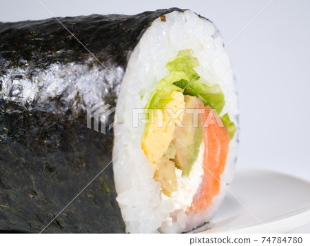 Avocado and salmon sushi rolls 74784780