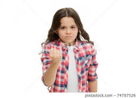 Girl kid threatening with fist isolated on white. Strong Girl kid threatening with fist isolated on white. Strong 74787526