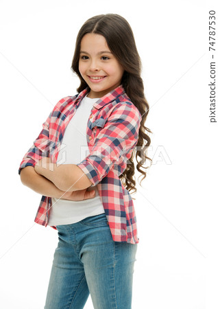 Kid girl long curly hair posing confidently. Girl curly hairstyle Kid girl long curly hair posing confidently. Girl curly hairstyle 74787530