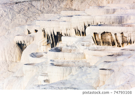 White travertine formations at hot springs of Pamukkale, Turkey White travertine formations at hot springs of Pamukkale, Turkey 74793108