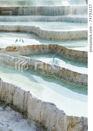 Natural travertine terraces with hot springs in Pamukkale, Turkey 74793237