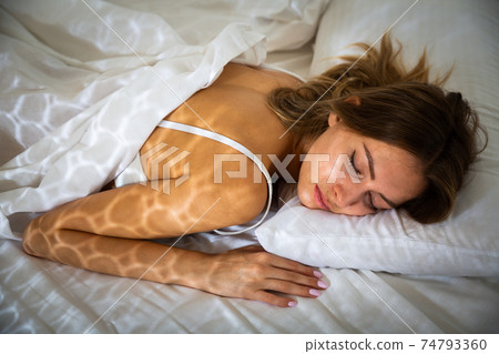 Ggirl in underwear sleeping in bed 74793360