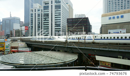 Shinkansen trains passing by on the elevated Yurakucho Shinkansen trains passing by on the elevated Yurakucho 74793676