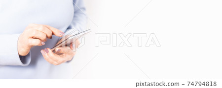Elderly hands holding mobile cell phone. Banner. 74794818