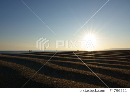 Evening view of the sandy beach 74796311