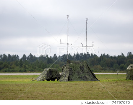 Military tent with radio and antenna camouflage net Military tent with radio and antenna camouflage net 74797070