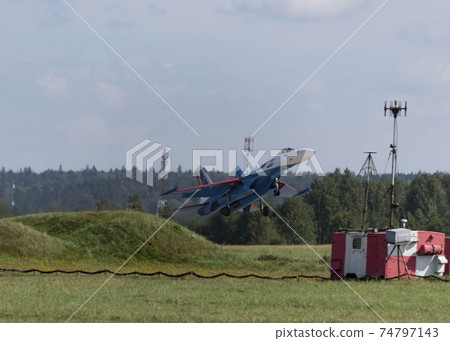 Moscow Russia Zhukovsky Airfield 31 August 2019: The Russian Knights Russkie Vityazi aerobatic team performs a demonstration flight with aerobatics figures of the international aerospace salon 74797143