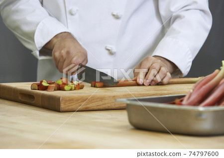 Chef Chopping Rhubarb Chef Chopping Rhubarb 74797600