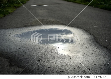 Asahi reflected in a puddle 74797630