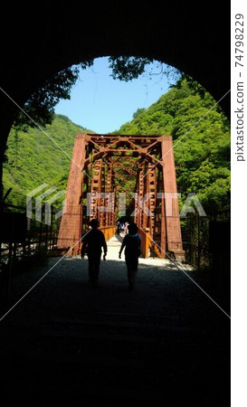 There was a red iron bridge when I passed through the tunnel There was a red iron bridge when I passed through the tunnel 74798229