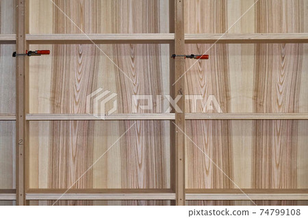 Ash veneered mdf bookcase in workshop. Wooden furniture 74799108