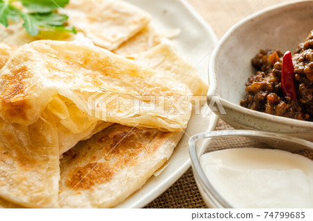 Roti, curry and yogurt Roti, curry and yogurt 74799685