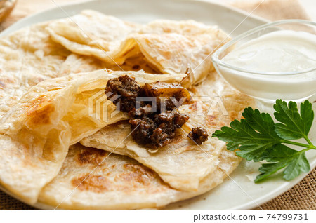 Keema curry on roti Keema curry on roti 74799731