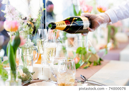Wedding reception, pouring champagne Wedding reception, pouring champagne 74800076