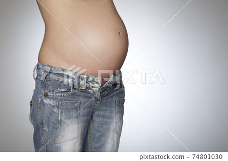 Pregnant Woman Wearing Jeans 74801030