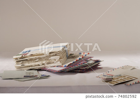 Stack of letters on table Stack of letters on table 74802592