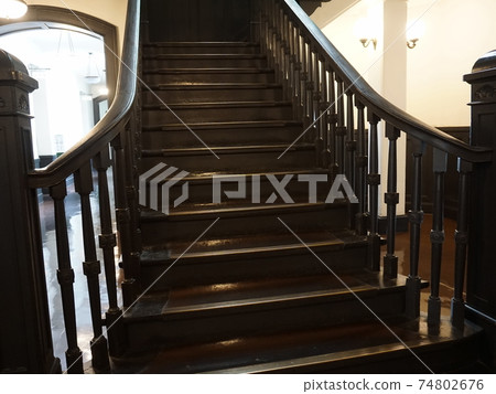 Brown wooden steps. Old vintage staircase. Rise up 74802676
