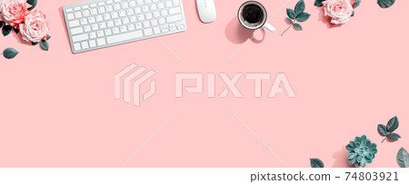 Computer keyboard and a mouse with pink roses 74803921