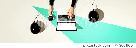 Person using a laptop computer with black balloons Person using a laptop computer with black balloons 74803960