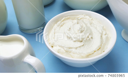 Whipped cream on blue background, top view 74803965