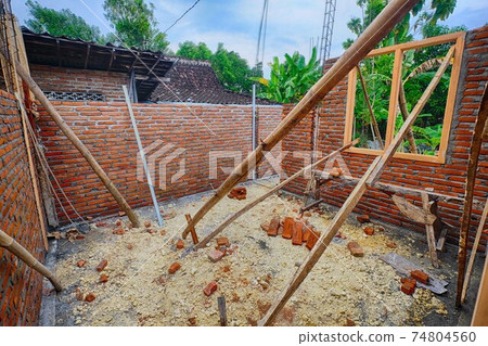 Construction site of a private house under construction in Indonesia 74804560