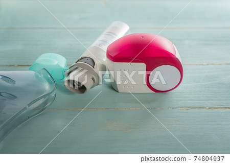 asthma inhaler and aerosol machine with inhaler mask close up asthma inhaler and aerosol machine with inhaler mask close up 74804937