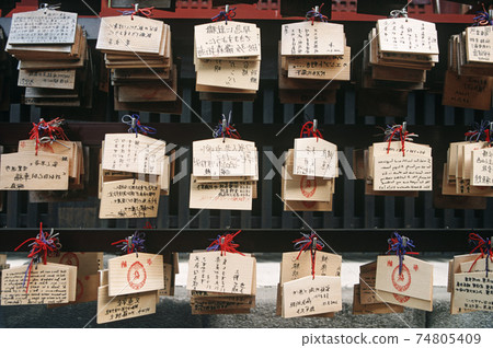 Tags in Chinese script hanging on rack Tags in Chinese script hanging on rack 74805409