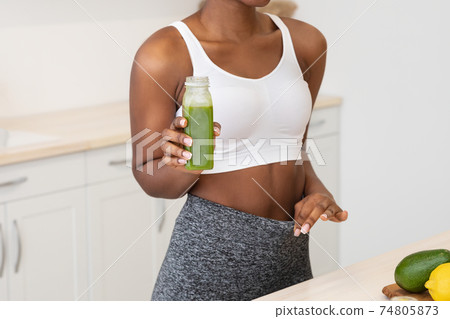 Black Woman Drinking Smoothie Losing Weight On Diet Indoor, Cropped Black Woman Drinking Smoothie Losing Weight On Diet Indoor, Cropped 74805873
