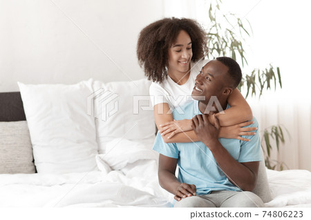 Attractive man and woman have fun in bedroom, love and happiness concept Attractive man and woman have fun in bedroom, love and happiness concept 74806223