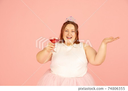 Beautiful caucasian plus size model isolated on pink studio background. Concept of inclusion, human emotions, facial expression 74806355