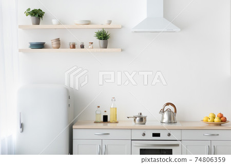 Stylish modern apartment with minimalist kitchen and Scandinavian interior 74806359