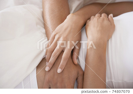 Couple Embracing In Bed Couple Embracing In Bed 74807070