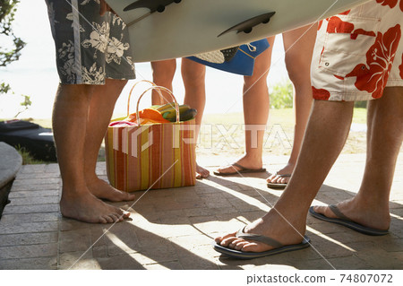 Friends With Surfboards On Porch 74807072