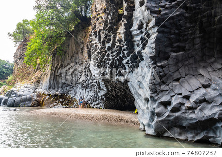 Basalt rocks and pristine water of Alcantara gorges in Sicily, Italy Basalt rocks and pristine water of Alcantara gorges in Sicily, Italy 74807232