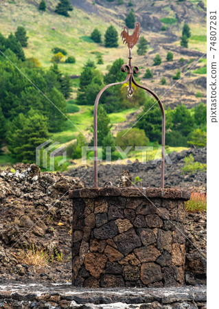 Santa Barbara refuge on Mount Etna and the lava stone well, Sicily Santa Barbara refuge on Mount Etna and the lava stone well, Sicily 74807281