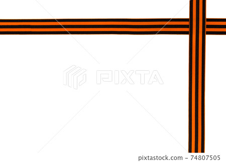 St. George ribbon on a white background. Black orange ribbon close up on a white background. 74807505