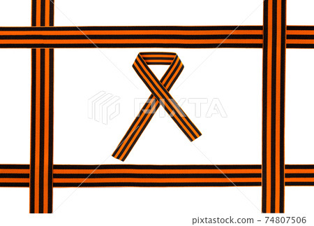St. George ribbon on a white background. Black orange ribbon close up on a white background. 74807506