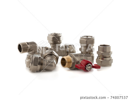Fittings for water on a white background. Brass fittings close-up. Fittings for water on a white background. Brass fittings close-up. 74807537