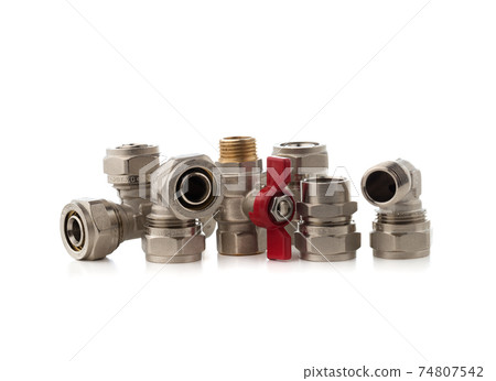 Fittings for water on a white background. Brass fittings close-up. Fittings for water on a white background. Brass fittings close-up. 74807542