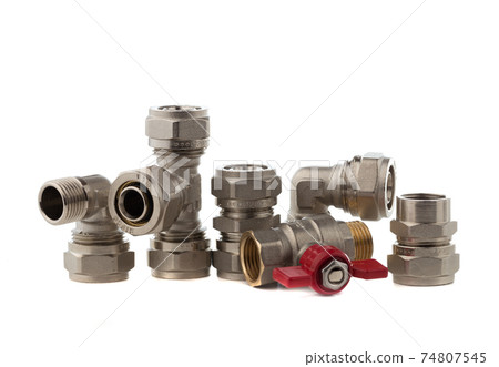 Fittings for water on a white background. Brass fittings close-up. Fittings for water on a white background. Brass fittings close-up. 74807545