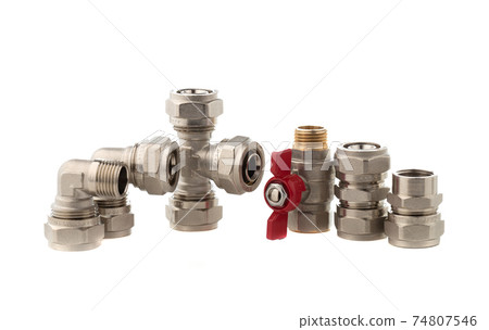 Fittings for water on a white background. Brass fittings close-up. Fittings for water on a white background. Brass fittings close-up. 74807546