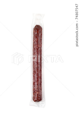 Salami on a white background. Sausage in vacuum packaging on a white background. Salami on a white background. Sausage in vacuum packaging on a white background. 74807547