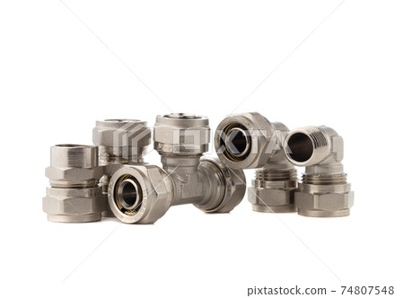 Fittings for water on a white background. Brass fittings close-up. Fittings for water on a white background. Brass fittings close-up. 74807548